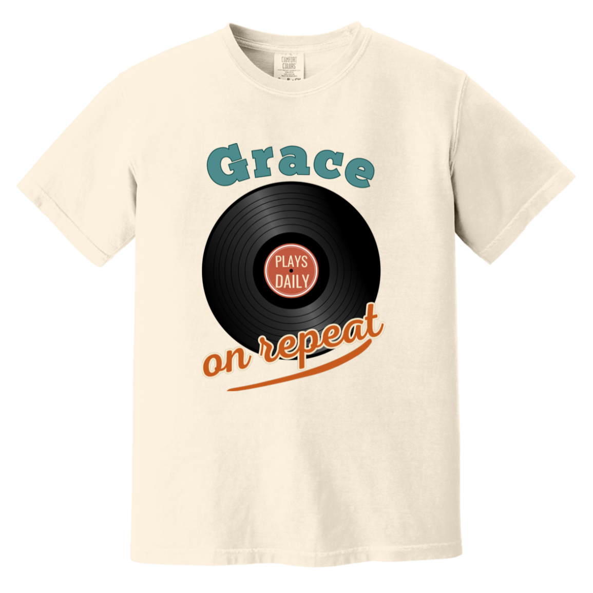 Ivory vintage-style Comfort Colors t-shirt featuring a retro vinyl record illustration and artistic “Grace Plays Daily on Repeat” typography.