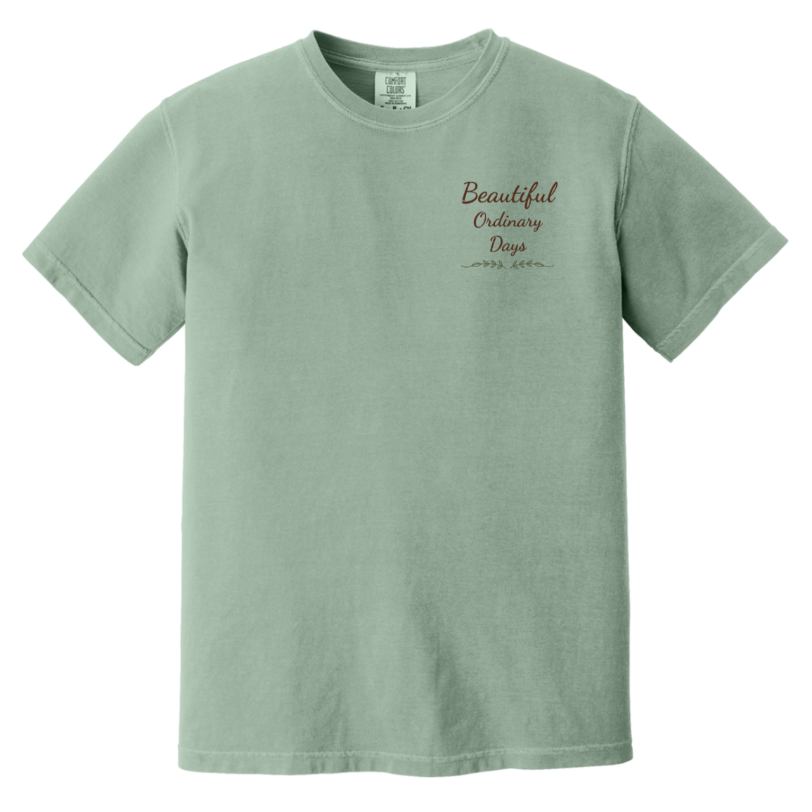 Beautiful Ordinary Days script logo chest design with decorative greenery on Comfort Colors t-shirt.