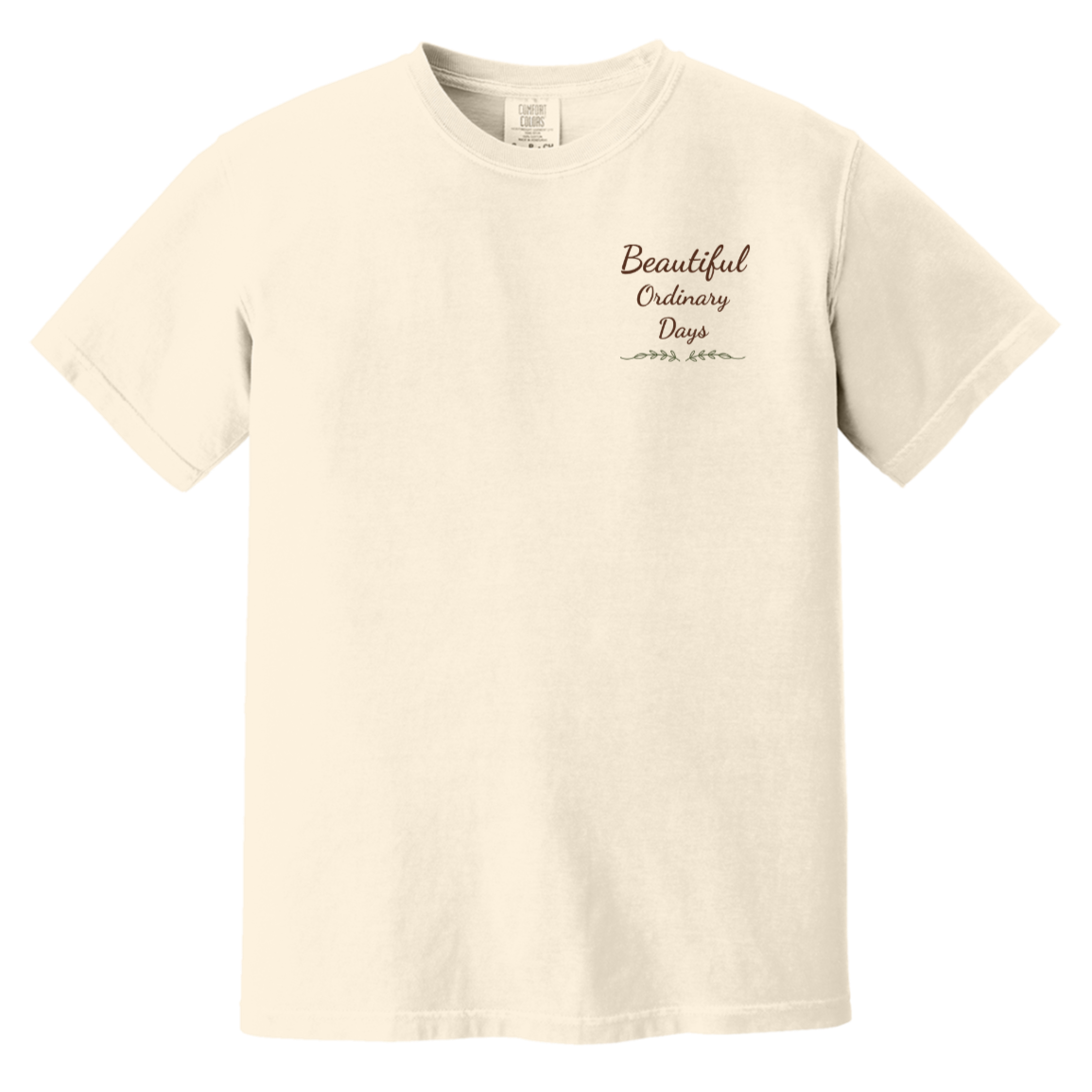 Beautiful Ordinary Days script logo chest design with decorative greenery on Comfort Colors t-shirt.