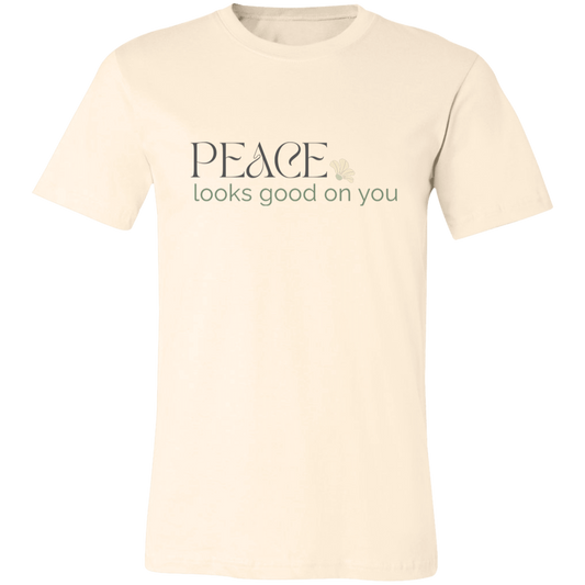 Peace Looks Good on You graphic t-shirt in Cream featuring a soft vintage-inspired neutral design.