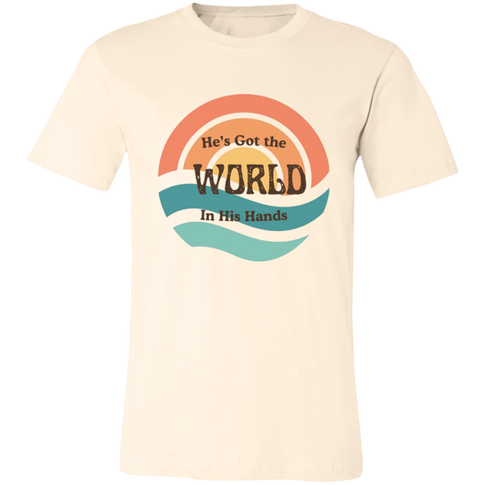 He's Got the Whole World vintage soul graphic tee featuring retro sunset colors and an uplifting faith-inspired message on a Bella + Canvas shirt