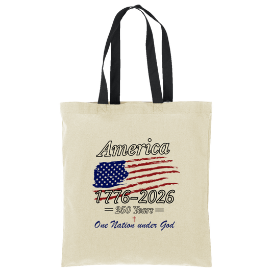 Cream canvas tote bag with black straps featuring patriotic America 1776-2026 design with distressed American flag and One Nation Under God text