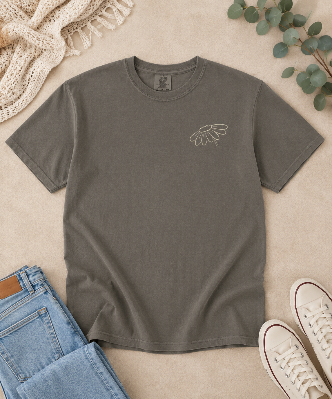 Front flat lay of a Pepper Comfort Colors T-shirt with a small cream wildflower left-chest design.