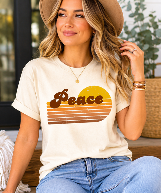 Woman wearing Peace Retro Revival Graphic Tee featuring groovy retro typography and vintage sunset stripes